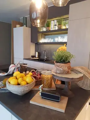a kitchen with a bowl of fruit on a counter at Your secret place to stay - Therme Meran in Merano
