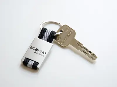a pair of keys on a white background at Stay COOPER l Cà de Bezzi in Bolzano