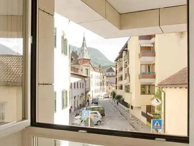 a view of a city street from a window at Stay COOPER l Cà de Bezzi in Bolzano