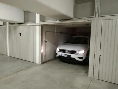 a car is parked inside of a garage at Appartment Trojer in Merano