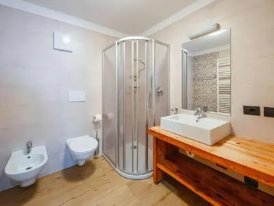 a bathroom with a sink and a shower and a toilet at Holiday Home Mantel by Interhome in Mazzin