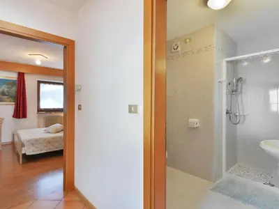 a bathroom with a sink and a toilet in a room at Apartment Lazzer-1 by Interhome in Campitello