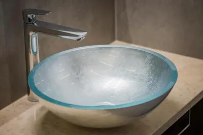 a sink in a bathroom with a faucet at Fior Apartments Lofts in Merano