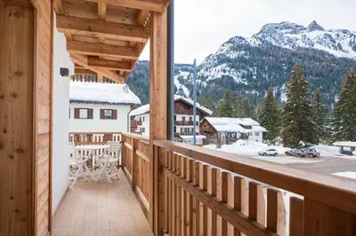 a balcony with a view of a snow covered mountain at Piccola Cesa B&B in Canazei