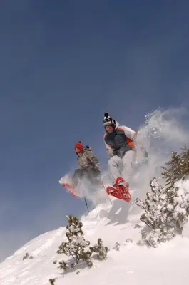 two people on snowboards on a snow covered mountain at Ferienwohnung Haus Reider in Sarntal