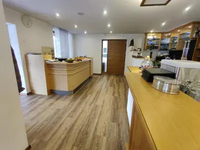 a kitchen with wooden floors and a counter top at Schlossberg in San Leonardo in Passiria