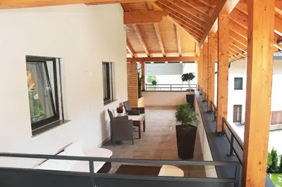 an indoor balcony of a building with wooden ceilings at Apartment Zimat in Chienes