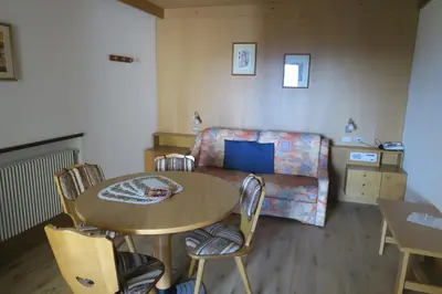 a living room with a table and a couch at Residence Scheidnerhof in Aldino