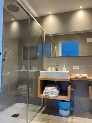 a bathroom with a sink and a shower at B&B Lavi Ortisei val Gardena in Ortisei