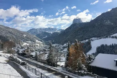 a view of a valley in the mountains with snow at B&B Lavi Ortisei val Gardena in Ortisei