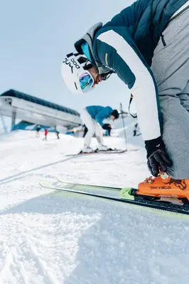 a person is on skis in the snow at Wiesenhof Gardenresort in San Leonardo in Passiria