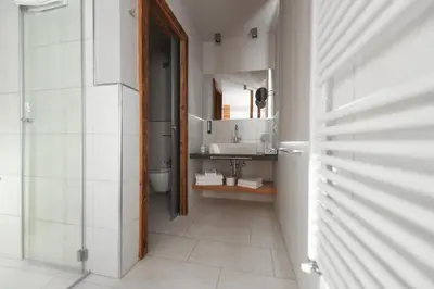 a bathroom with a sink and a mirror at Chalet Vites Mountain Hotel in Canazei