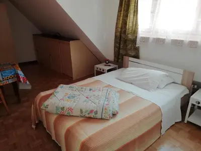 a bedroom with a bed in a room at Pension Flora in Ora/Auer