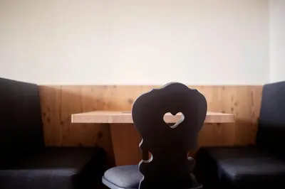 a room with a table with a heart on it at Wanderhotel Teiserhof in Funes