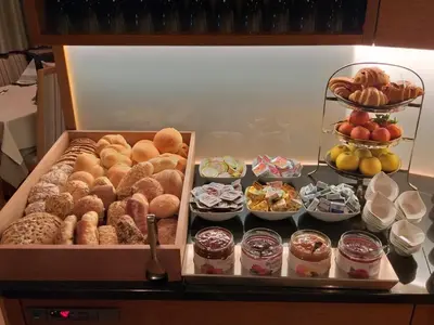 a refrigerator filled with lots of different types of donuts at Garni Pöhl in Tirolo