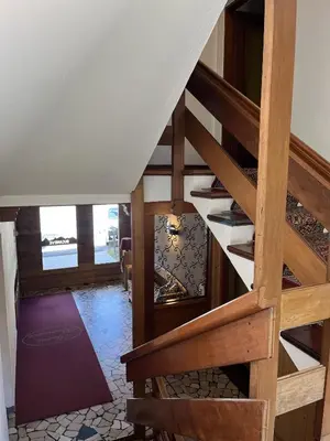 a staircase in a house with a stair case at B&B Bucaneve in Vigo di Fassa