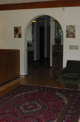 a living room with a couch and a rug at Dependance Villnerhof in Egna