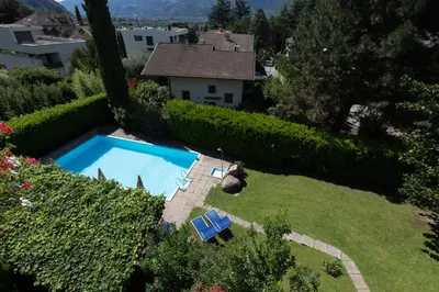 an aerial view of a backyard with a swimming pool at Pension Sankt Urban in Merano