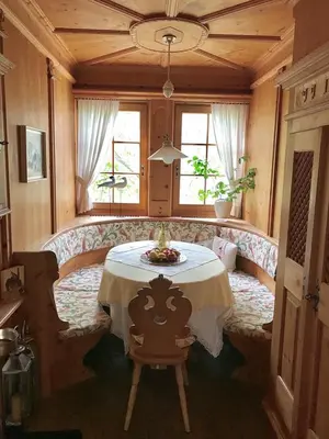 a restaurant with two tables in a room at Garni Hotel Burgleitenhof in Lana