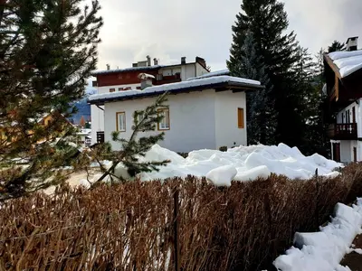 a house with snow in front of it at luminoso ed accogliente, centralissimo appartamento indipendente in Cortina dʼAmpezzo