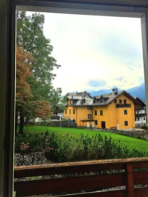 a view of a house from a window at luminoso ed accogliente, centralissimo appartamento indipendente in Cortina dʼAmpezzo
