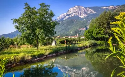 a river with a mountain in the background at Gisshübelhof in Andrian