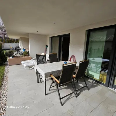 a dining table and chairs on a patio at Sonnenparadies in San Genesio Atesino