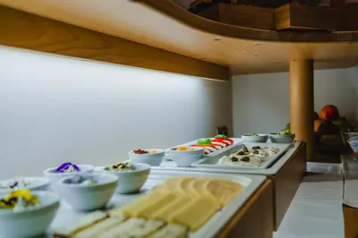 a buffet line with many different types of food at Garni Hotel Belalp in Santa Cristina in Val Gardena