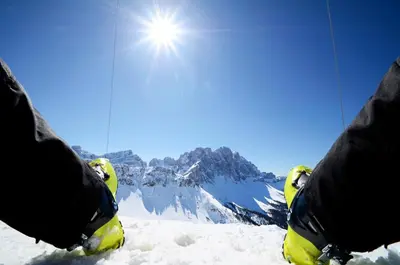 a person is standing on a snow covered mountain at Transit Rooms - Your Stopover, Free Parking in Vipiteno