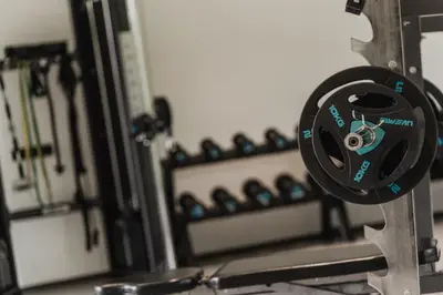 a close up of a barbell in a gym at Klein Fein Hotel Anderlahn in Parcines