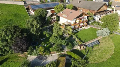 an aerial view of a house with a solarium at Kastnerhof in Meltina