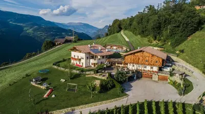 an aerial view of a house on a hill at Apartments Pitschlmann in Fiè