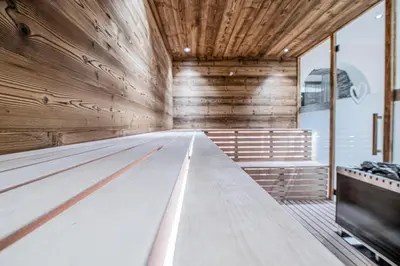an empty bowling lane in a wooden gymnasium at Hotel Wieser in Campo di Trens