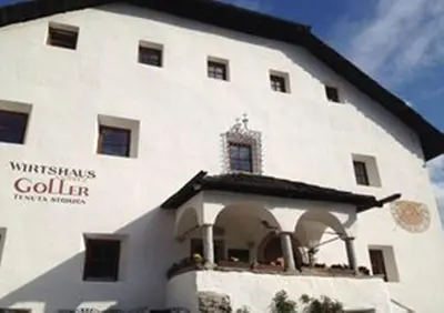 a large white building with a window on it at Ansitz Goller in Rasun di Sopra