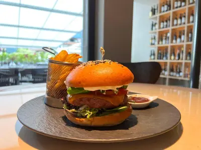 a sandwich on a plate on a table at Hotel Panorama in Rablà