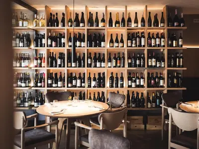 a room filled with lots of bottles of wine at Hotel Panorama in Rablà
