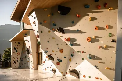 a indoor climbing wall with a large rock wall at Sonnen Resort in Naturno