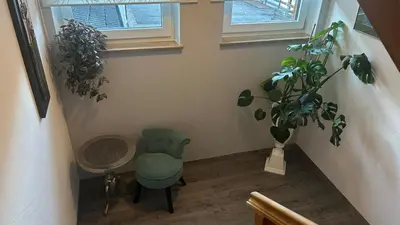 a yard with a playground with flowers and a house at Appartements Sigmair in Valdaora