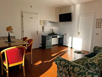 a living room with a couch and a table at St. Vigilhof in Nalles