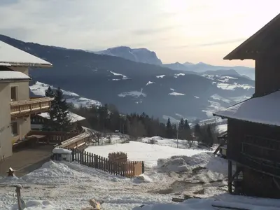 a view of a snow covered valley with a mountain at Steierhof in Feldthurns