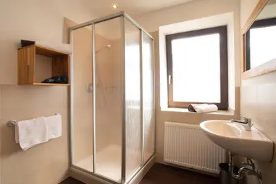 a bathroom with a shower and a sink at Residence Untermösslhof in Lana