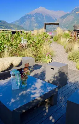 a table with a glass vase on top of it at Gapphof in Lagundo