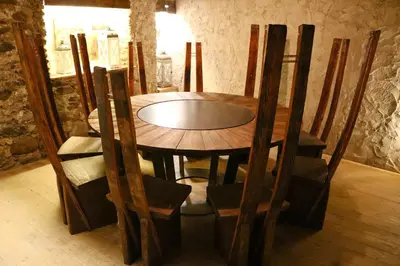 a wooden table and chairs in a room at Gapphof in Lagundo