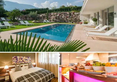 a house with a swimming pool and a villa at Hidalgo Suites in Postal