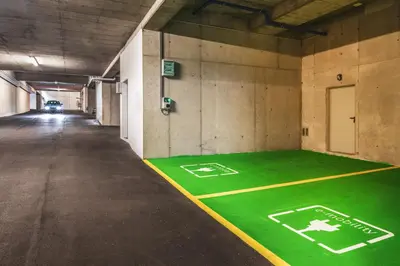 a baseball field painted on the floor of a parking garage at Hidalgo Suites in Postal