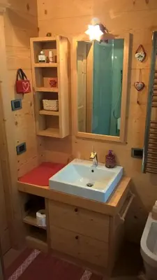 a bathroom with a sink and a mirror at Vista Pelmo in Colle Santa Lucia