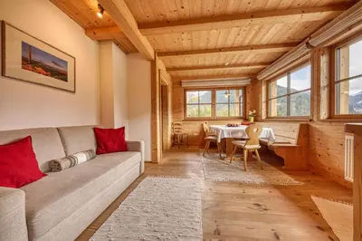 a living room with a couch and a table at Zyprianhof in Nova Levante