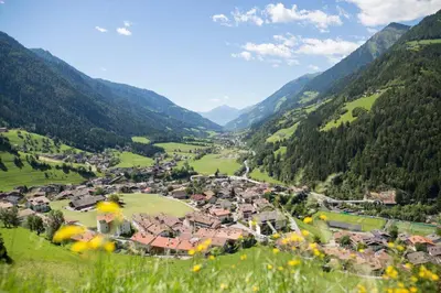 a small town in a valley in the mountains at Apartments Hubertus - central St Leonhard - free parking - Netflix - PasseiertalCard included - hiking and biking from doorstep in San Leonardo in Passiria
