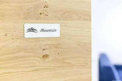 a sign that says mountain on a wooden wall at Apartment Terme in Merano
