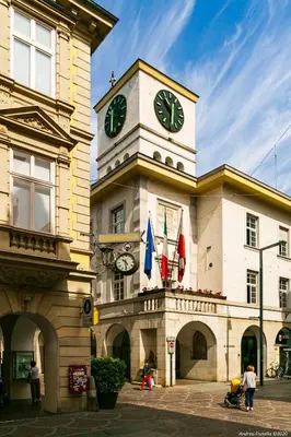 a building with a clock tower on top of it at Apartment Terme in Merano